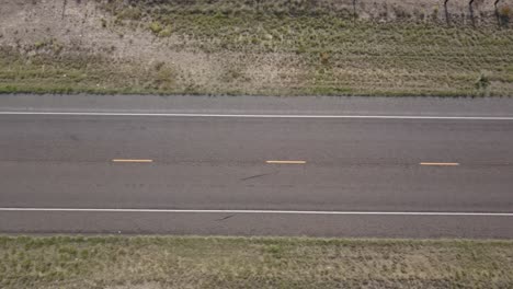 Drone-—-Looking-straight-down-at-a-long-stretch-of-Texas-highway