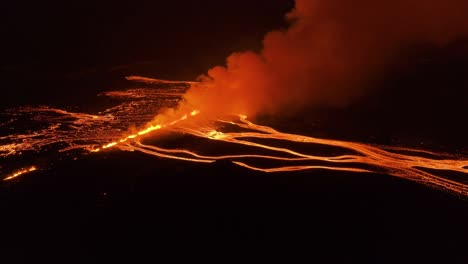 Large-fissure-volcanic-eruption-in-Iceland-during-night,-aerial