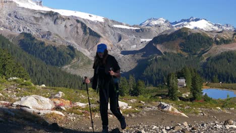 Female-Backpacker-Hiking-With-Trekking-Poles-At-Elfin-Lakes
