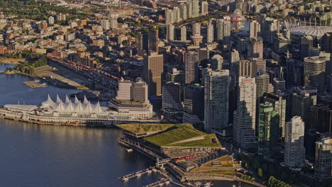 Vancouver-BC-Canada-Aerial-v55-zoomed-birds-eye-view,-drone-flyover-the-harbour,-tilt-up-capturing-Gastown-and-downtown-cityscape---Shot-with-Mavic-3-Pro-Cine---July-2023