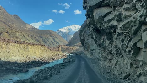 Front-view-of-empty-dangerous-JSR-Road-during-sunny-day-in-Skardu,-Pakistan