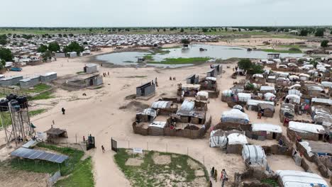 Aerial-panaromic-view-of-refugee-town-with-people-settled-in-West-Africa