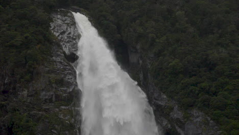 Slow-Motion-static-footage-of-the-top-of-a-waterfall-in-Milford-Sound---Piopiotahi,-New-Zealand