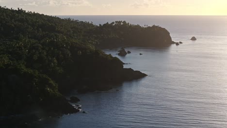 Pristine-remote-Caribbean-coastline-with-tropical-vegetation-at-sunset