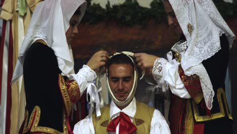 Ritual-dressing-of-Su-Composidori,-Sartiglia-feast,-Oristano,-Sardinia,-Italy,-Europe-Mask-dressing-up