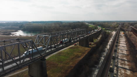 Cars-on-bridge-at-west-memphis-delta-regional-river-park,-tennessee,-daytime,-aerial-view