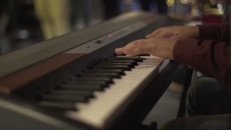 A-man-playing-on-piano-in-the-theatre-static-shot,-close-up-shot,-insert-shot