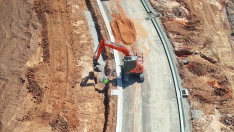 Yarrawonga,-Victoria,-Australia---18-March-2018:-Orange-excavator-at-work-on-a-construction-site-in-Yarrawonga-Victoria-Australia