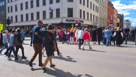 Children-and-Families-With-Norwegian-Flags-Walking-in-Downtown-Oslo,-Parade-and-Celebration-of-National-Holiday,-Constitution-Day