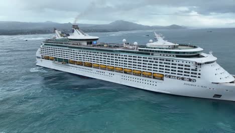 Royal-Caribbean-cruise-ship-navigating-in-open-ocean-toward-coast-of-Puerto-Plata-in-Dominican-Republic