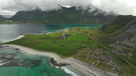 Remote-roads-Lofoten-with-parked-cars-and-beach,-Norway