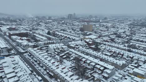 Aerial-flyover-snow-covered-Town-in-America-in-winter