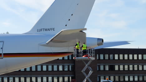 Airport-Ground-Crews-On-Lifting-Platform-Next-To-Airbus-At-Cologne-Airport-In-Germany