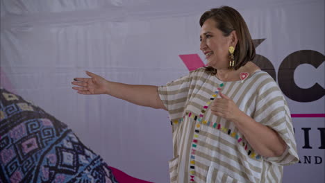 Mexican-female-presidential-candidate-Xochitl-Galvez-taking-pictures-with-her-supporters-and-the-official-campaign-jingle-playing-in-the-back