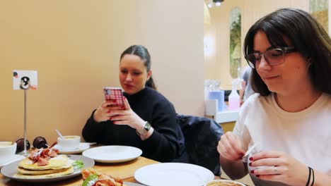 Friendly-gathering-for-coffee-and-pancakes-for-breakfast-at-a-cafe-in-Dublin