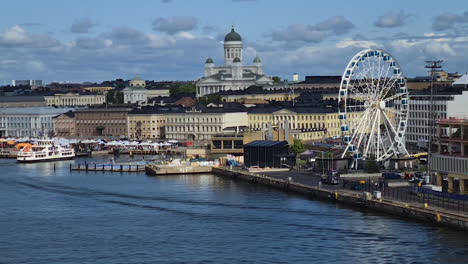 Helsinki,-Finland-Cityscape-Skyline-From-Harbor,-Cathedral,-Ferris-Wheel,-Boats-and-Buildings