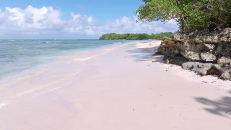 Beautiful-La-Playita-beach-in-Las-Galeras-on-the-Samaná,-Dominican-Republic_pan-shot