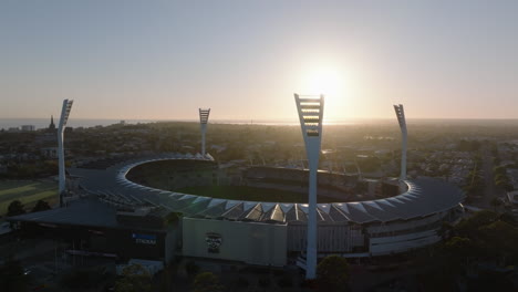 AERIAL-Early-Morning-Sun-Shinning-Over-Kardinia-Park,-Geelong-Australia