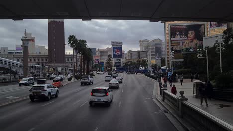 Driving-and-Traffic-on-Las-Vegas-Strip-Boulevard-on-Cloudy-Day,-Nevada-USA