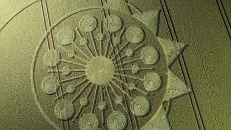 Fields-With-Crop-Circle-Formation-In-Owslebury,-England---Aerial-Drone-Shot