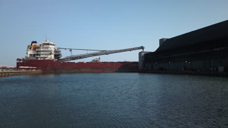 Wide-shot-of-a-ship-unloading-at-Redpath-Sugar-Refinery-in-Toronto