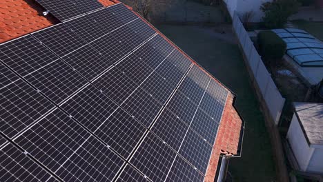 Photovoltaic-Panels-On-The-Roof-Of-The-House---Drone-Shot