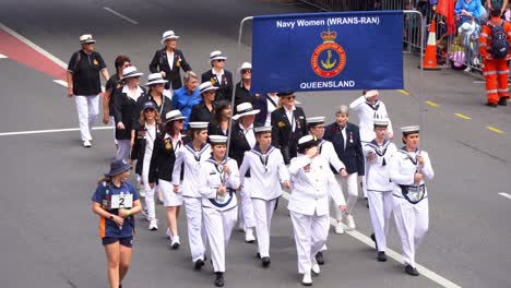 The-Women's-Royal-Australian-Naval-Service-marches-down-Adelaide-Street-in-the-traditional-Anzac-Day-parade,-paying-tribute-to-those-who-served-in-the-war