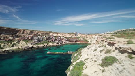 Malta,-droneshot-revealing-Popeye-Village,-aerial