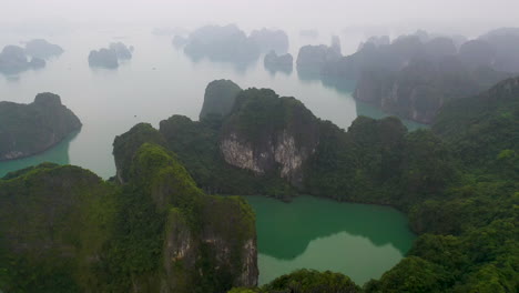 High-aerial-tilt-down-over-picturesque-Halong-Bay,-Vietnam