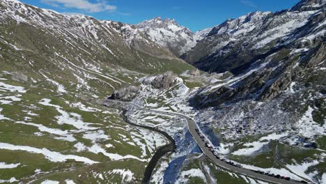French-Pyrenees-Scenic-Road-and-White-Snow-Mountain-Peaks---Aerial-4k