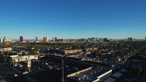 West-Side-of-Las-Vegas-USA,-Drone-Shot-of-Strip-Buildings-in-Skyline-and-Suburban-Traffic-on-Golden-Hour-Sunlight