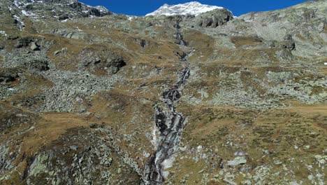 Waterfall-and-Mountain-Landscape-in-Zillertal-Alps,-Austria---Aerial-4k-Pedestal