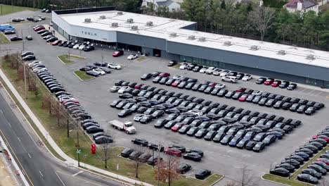 Aerial-drone-footage-showing-the-massive-amount-of-electric-EV-inventory-at-a-tesla-dealership