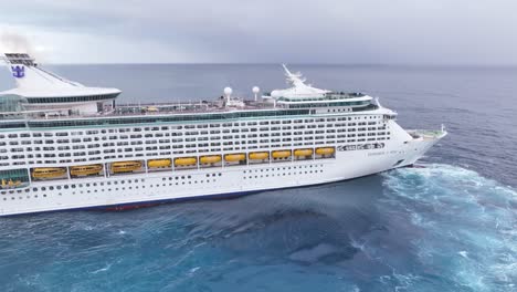 Flying-around-Royal-Caribbean-Explorer-of-the-Seas-cruise-ship-navigating-in-open-ocean