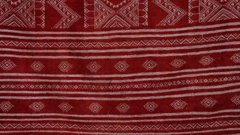 Red-Tunisian-patterned-fabric,-detailed-traditional-design-close-up