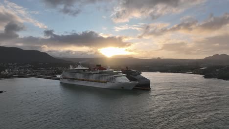 Two-Cruise-ships-at-Puerto-Plata-port-at-sunset,-aerial-drone-view