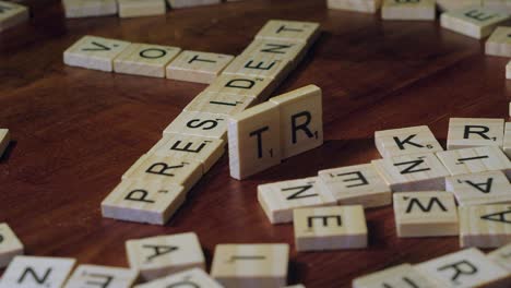 Scrabble-game-tile-letters-form-words-VOTE,-PRESIDENT-and-TRUMP