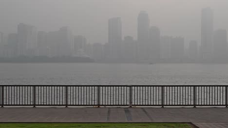 A-view-of-a-foggy-winter-morning-at-Khalid-Lagoon-in-Sharjah,-United-Arab-Emirates