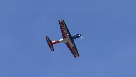 Single-Engine-Super-Chipmunk-Flying-at-Airshow-Blue-Sky-Backdrop-TRACK