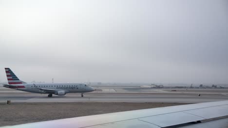 American-Eagle-Jet-Taxiing-on-the-Taxiway-at-the-Airport-SLOMO