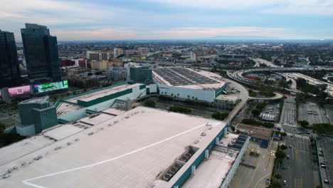 Drone-Shot-of-Los-Angeles-Convention-Center-and-Traffic-on-CA-110-California-State-And-I-10-Interstate-Route-Highway-USA