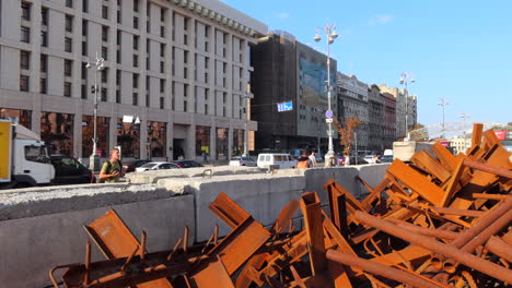 Czech-hedgehogs-on-Khreshchatyk-main-road-street-in-Kyiv-Ukraine,-Dragon's-teeth-anti-tank-stoppers,-Russia-Ukraine-war,-famous-Wwii-obstacles,-4K-shot