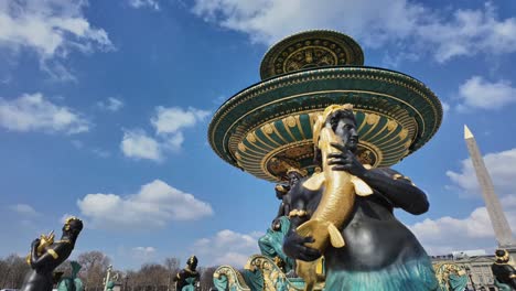 Close-up-of-fountain-at-Place-de-la-Concorde-square-with-obelisk-in-background,-Paris-in-France