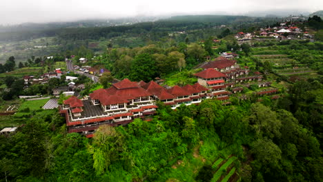 Sitting-high-above-green-fields-of-Bali,-desolate-hotel-closed-for-business