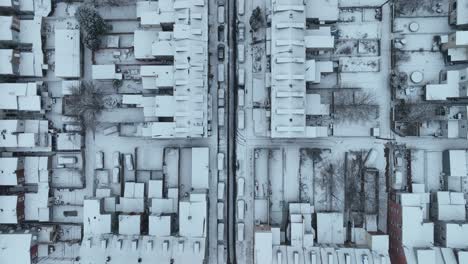 White-snow-covered-housing-area-with-blocks,-Settlement-and-apartments-in-american-town