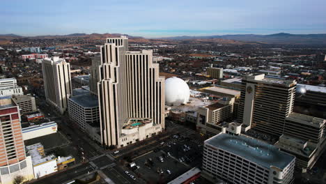 Reno,-Nevada-USA,-Aerial-View-of-Downtown,-Silver-Legacy-and-Eldorado-Hotels-and-Casinos,-Drone-Shot