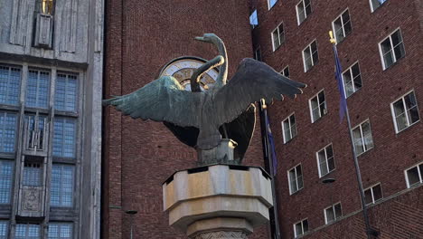 Statue-in-Front-of-Oslo-Radhus,-City-Hall-Building,-Approaching-POV