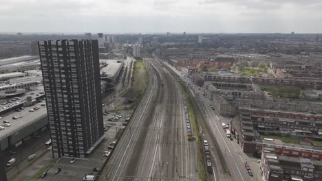 Droneshot-over-railway-tracks-in-the-Hague,-Netherlands