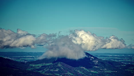 Time-lapse-cloud-formation-moving-over-mountain-green-landscape-nature-hills