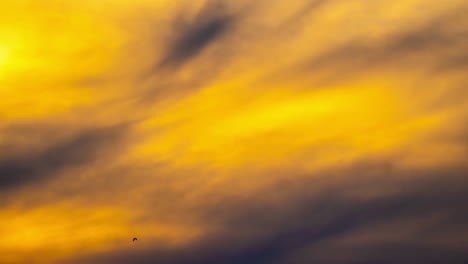 Yellow-hazy-sunset-cloudscape-time-lapse---sky-only-background